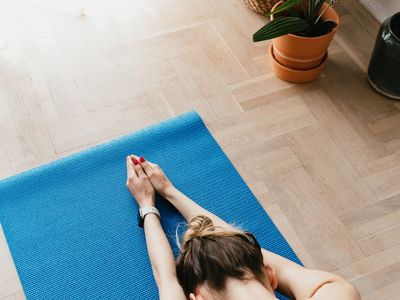 An empty, serene yoga mat in a well-lit room.